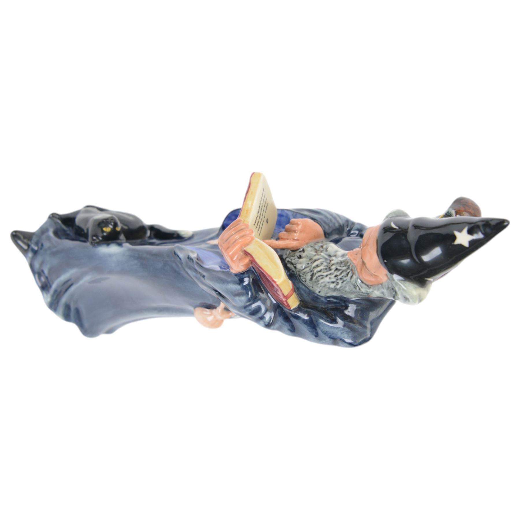 Four Royal Doulton figures, comprising The Mark Seller HN2103, The Wizard HN2877, The Blacksmith Arms HN2782, Morning Ma'am HN2895 