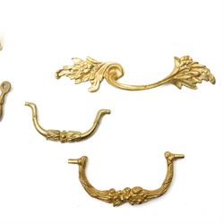 Set of eight brass cabinet door plates formed as lyres marked 'H.V' 9.5cm x 12cm, seven brass cabinet door handles of leaf design, various other handles, boss and a two branch wall light 
Provenance: property of a Nobleman