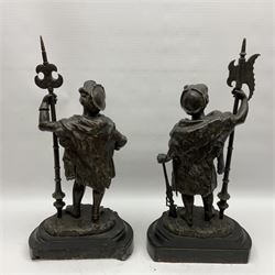Pair of bronzed figure modelled as a hunter in traditional dress, each holding a pike, H48cm