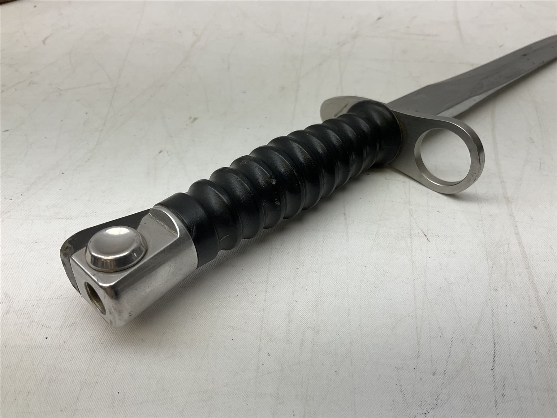 Swiss Model 1957 SIG rifle bayonet by Wenger with 23.5cm steel blade numbered 350857; in plastic scabbard with leather frog stamped GSCH 85 L38cm overall; and Egyptian Hakim rifle bayonet with the same script number to the grip and steel scabbard (2)