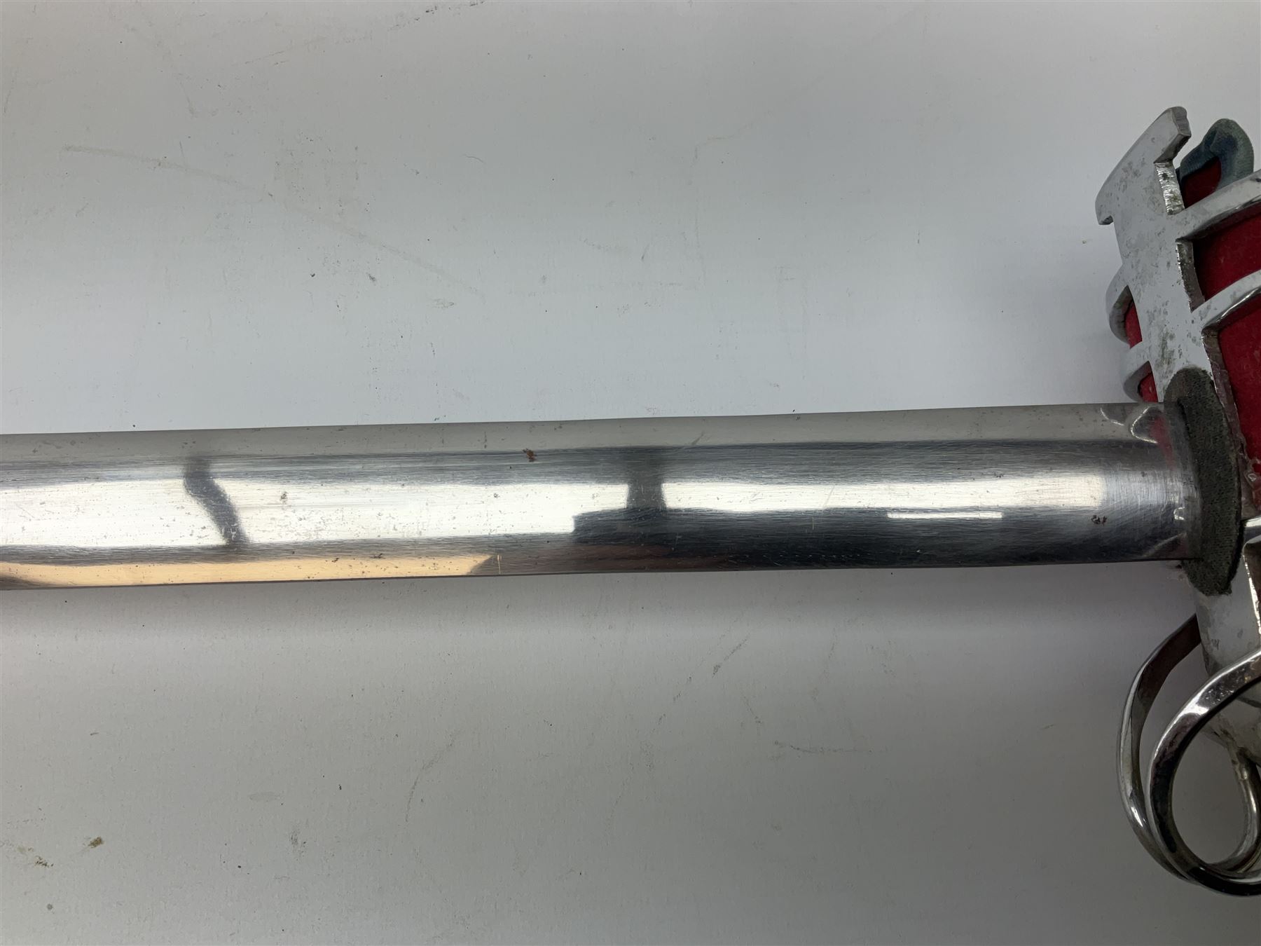 Reproduction Scottish basket hilted broadsword with 85cm double edged steel blade and red lined basket hilt with wire bound grip, in white metal mounted leather scabbard 107cm overall