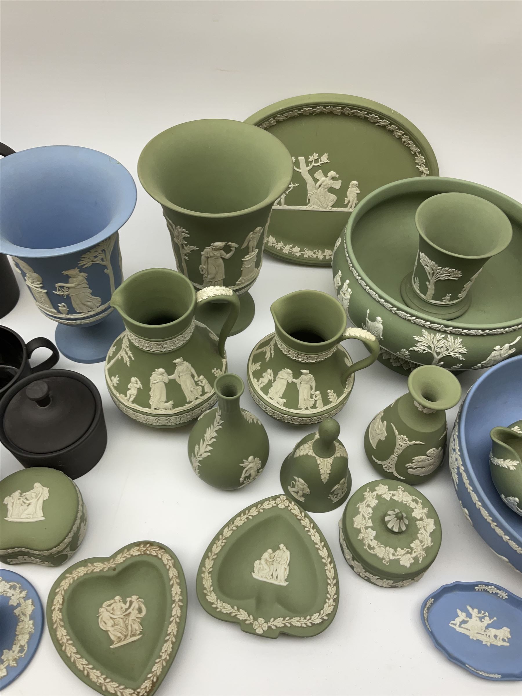 Collection of Wedgewood light blue and sage green Jasperware, to include blue bowl, D20cm, green footed bowl, D20cm, two large vases, trinket boxes, jugs, plates, etc., (29), together with a Wedgewood Black basalt coffee set, comprising coffee pot, milk jug, lidded sugar bowl and six coffee cans and saucers. 