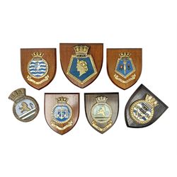 Six Naval wall shields, including HMS President, Vanguard, HMS Kilmorey etc, and another plaque 