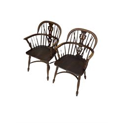 Pair late 20th century oak Windsor elbow chairs, double hoop and stick back with pierced and fretwork work splat, dished seat on turned supports joined by crinoline stretcher