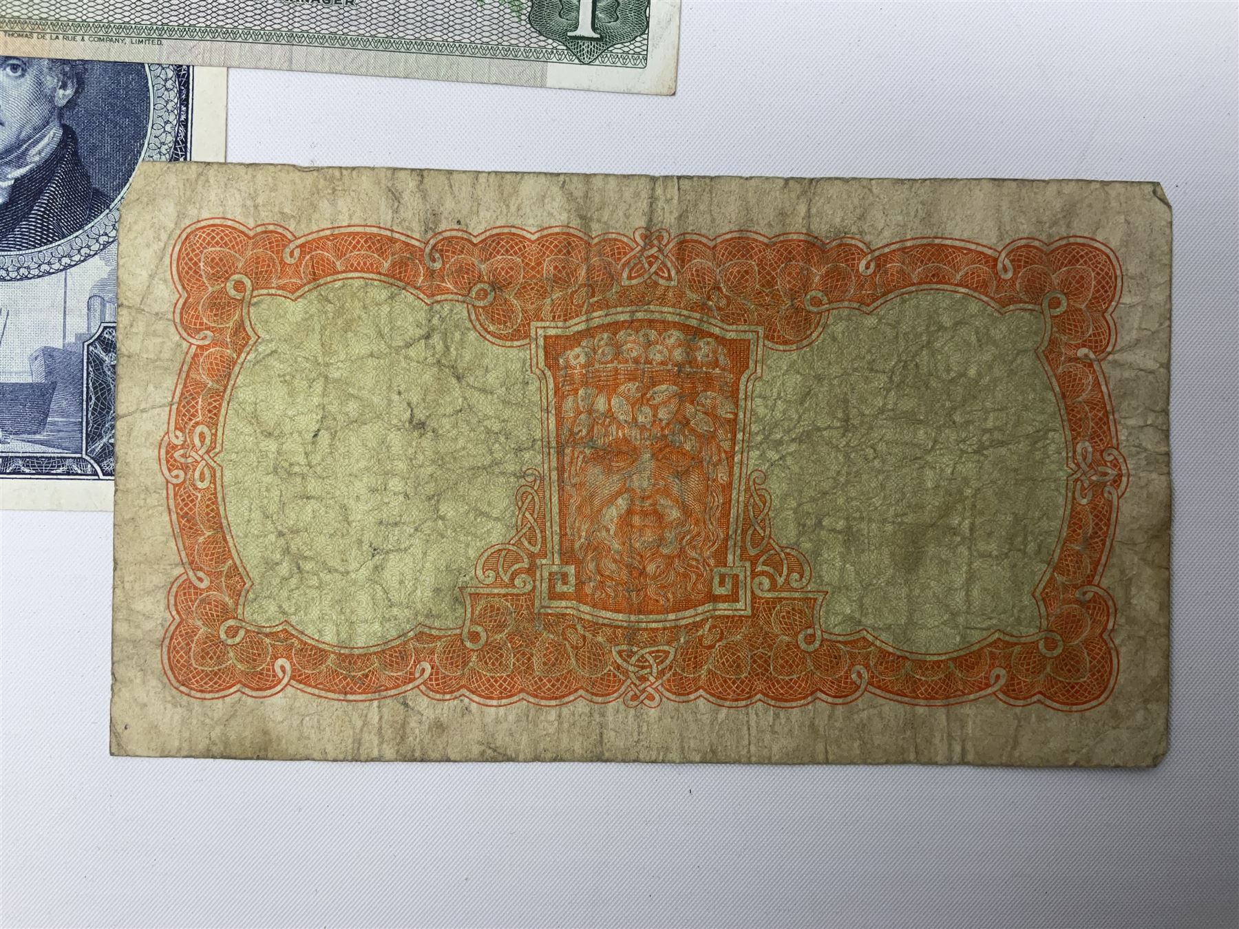 Irish and Scottish banknotes to include Bank of Ireland 5 January 1939 ‘B15’ one pound, two Bank of Scotland 1964 ‘AD07’ and ‘AF05’ one pound notes, one 1966 ‘CQ77’ one pound, and further notes from Clydesdale Bank, National Commercial Bank of Scotland Ltd. etc, housed in plastic sleeves