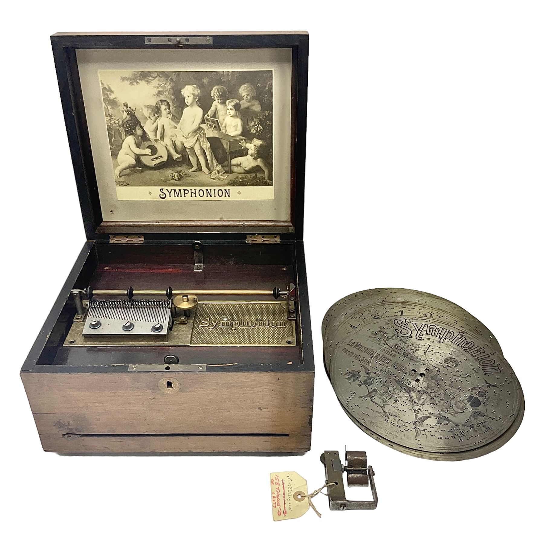 Late 19th century Symphonion disc musical box for spares or repair, inlaid walnut case with front lever action, playing 25.5cm discs on a 10.5cm steel comb with forty-nine teeth, musical scene of cherubs under the lid, L33cm; together with twelve 25.5cm discs