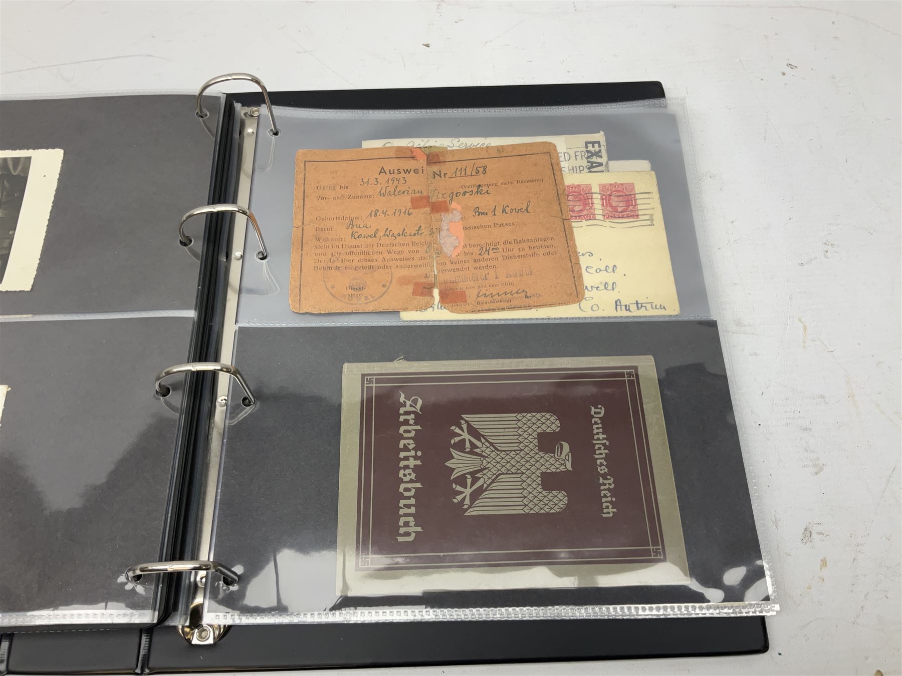 Modern loose leaf album of WW2 German postcards, photographs and other paper ephemera including Adolf Hitler, Luftwaffe, comic, soldier and group portraits, memorial cards, propaganda images, interesting postmarks etc