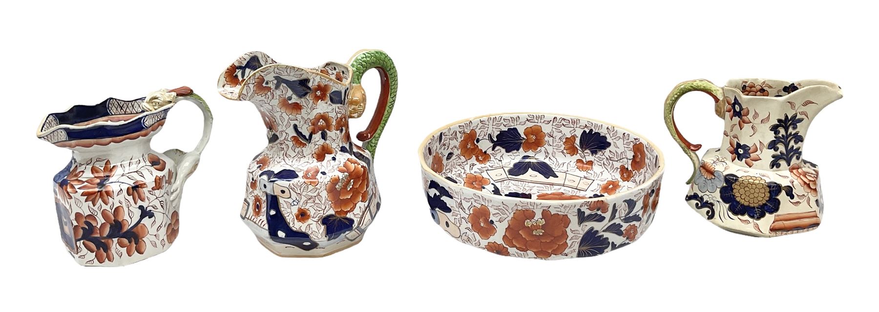 19th century ironstone wash jug and bowl set decorated in the Imari palette, together with two further smaller ironstone jugs similarly decorated, bowl D35cm