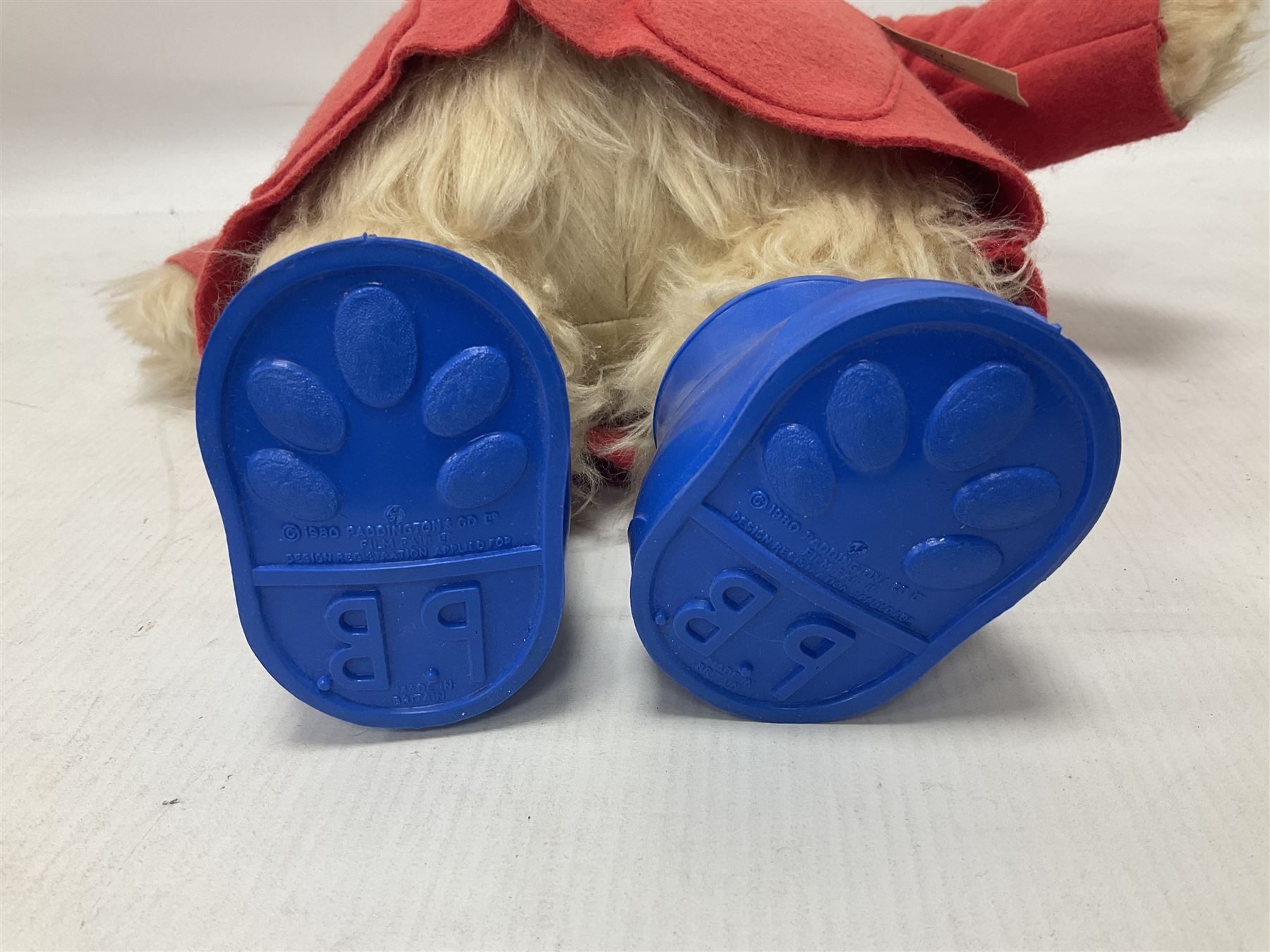 Gabrielle Designs Paddington Bear c.1981 with original labels, felt blue hat and red coat with blue rubber boots marked PB 1980  