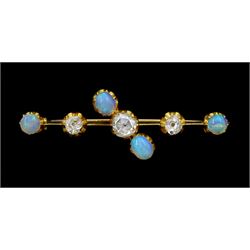 Early 20th century 15ct gold opal and diamond brooch, the central rose cut diamond, with old cut diamonds set either side, total diamond weight approx 0.60 carat