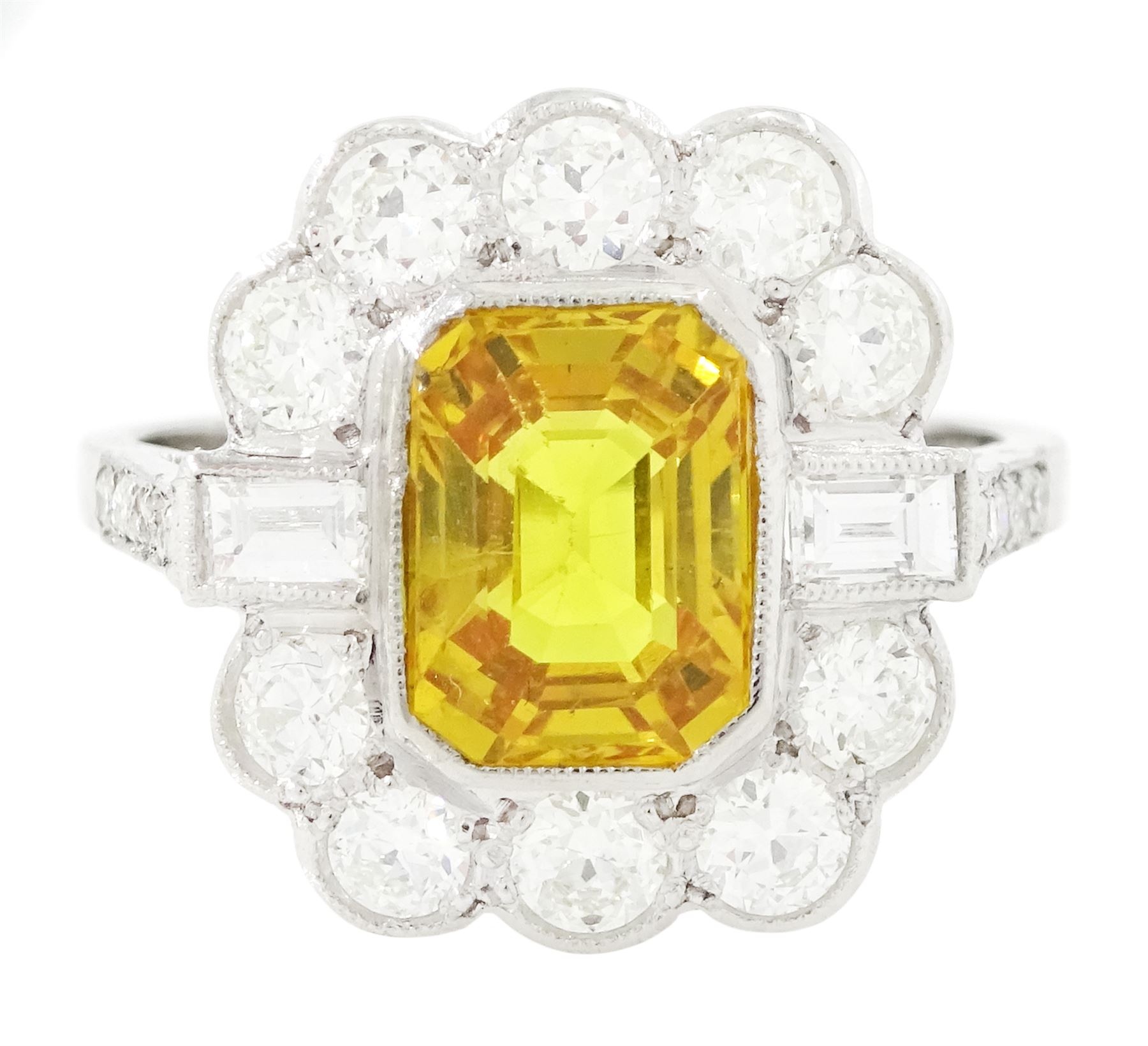 Platinum yellow sapphire and diamond milgrain set cluster ring, single octagonal cut sapphire of approx 2.20 carat, surrounded by two baguette cut diamonds and ten transitional cut diamonds and diamond set shoulders, stamped Plat, total diamond weight approx 0.95 carat