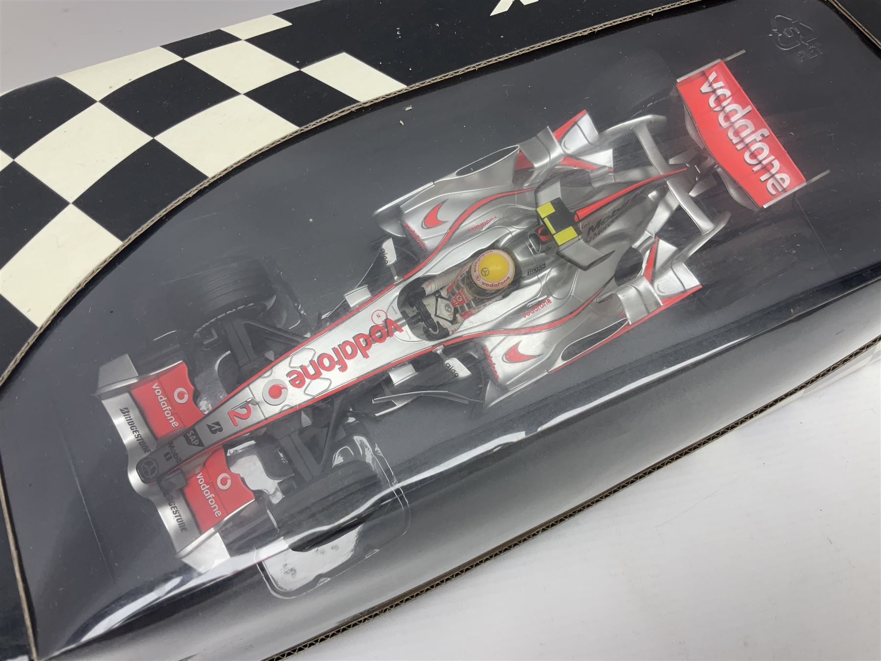 Three Minichamps 1:18 scale die-cast McLaren racing cars - Mercedes MP4-19 D. Coulthard; Mercedes MP4-20 K. Raikkonen; and Vodaphone Mercedes MP4-22 L. Hamilton 2007; all boxed (3)


