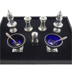 Pair of silver salts, with blue glass liners, Birmingham 1920, five silver pepperettes, all hallmarked (one stamped), approx 4.7oz