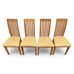 Contemporary teak dining suite comprising extending table and eight chairs, the table with rectangular plank top and one additional leaf extending to 210cm, supported on square tapering legs, the chairs with tall slatted backs and cream upholstered seats