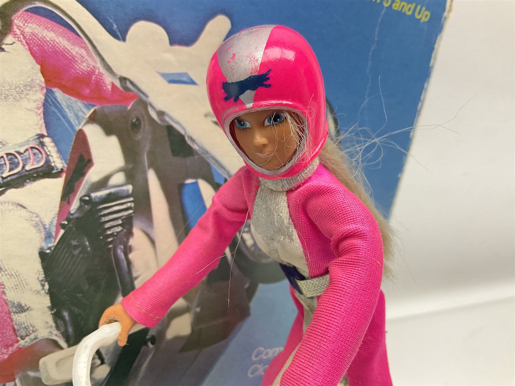 Ideal Derry Daring and Her Trick Cycle, with clothed figure on trick cycle and winder; in original illustrated box dated 1975