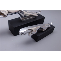  Modern graduated pair of Jaguar aluminium car mascots, each mounted on black oblong block base, largest L30cm  