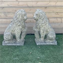 Pair of cast stone seated lions, looking left and right - THIS LOT IS TO BE COLLECTED BY APPOINTMENT FROM DUGGLEBY STORAGE, GREAT HILL, EASTFIELD, SCARBOROUGH, YO11 3TX