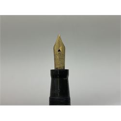 Vintage Swan Mabie Todd lever fill fountain pen in coral red, the nib a/f marked 14K, together with two further vintage Swan Mabie Todd fountain pens, the first example with lever fill, the other leverless, each with black body, one with nib marked 14ct, (3) 