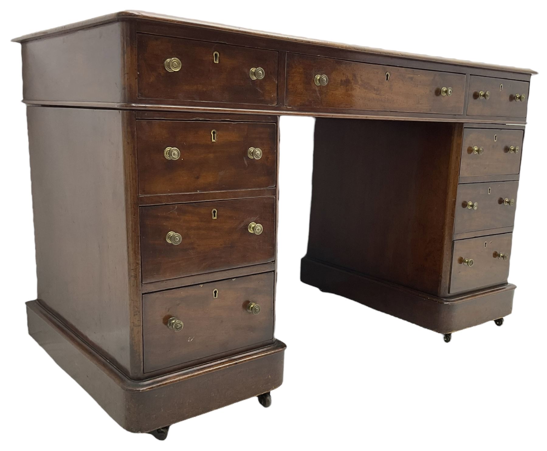 Victorian mahogany twin pedestal desk, rectangular top with inset ebonised leather writing surface, fitted with nine graduating drawers with brass pull handles, on plinth bases