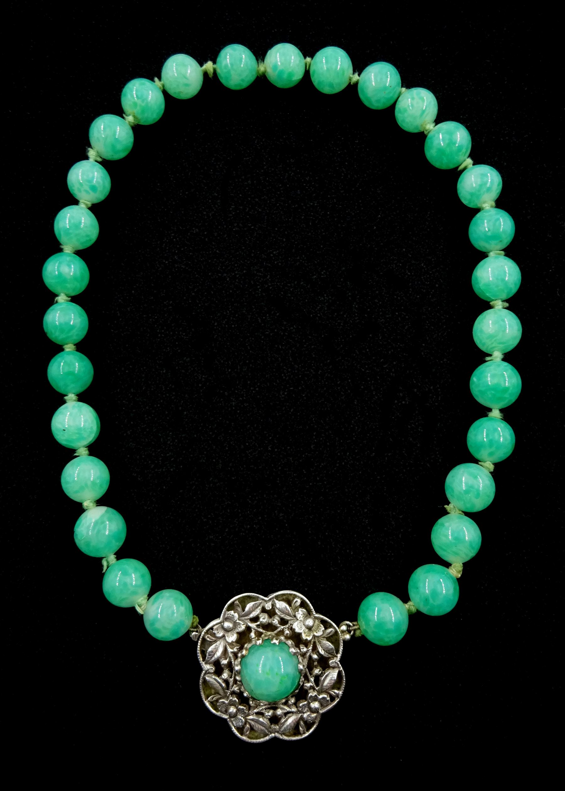 Chinese jade bead necklace with silver open work clasp with a cabochon greenstone/possibly jade bead necklace, signed Liu with Chinese character marks