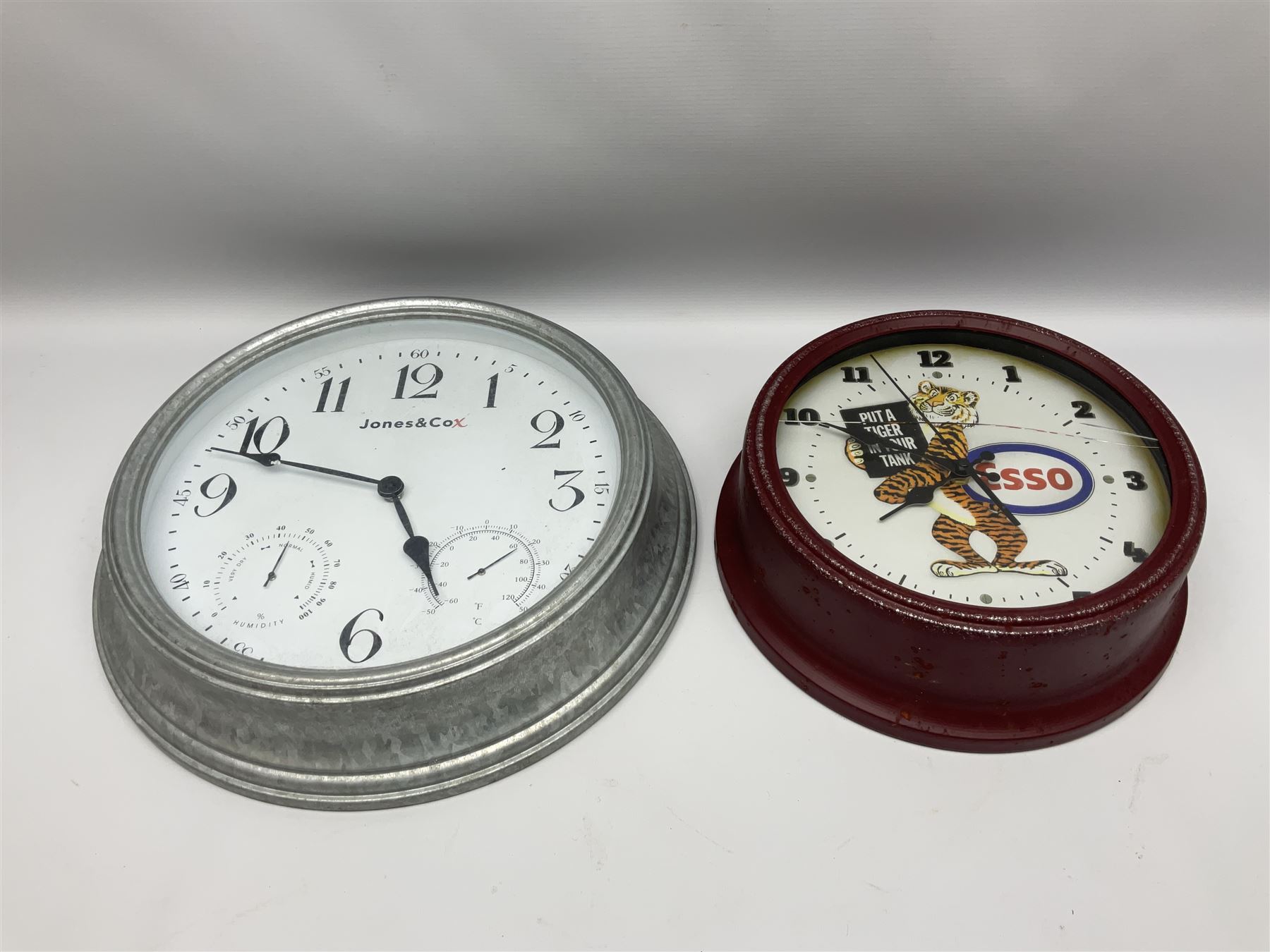 Esso Advertising Wall Clock, 'Put A Tiger In Your Tank', together with Jones & Co wall clock, largest example D40cm