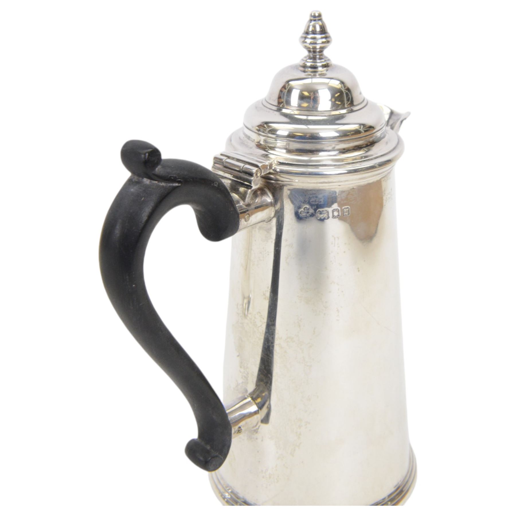 1930's silver two piece cafe au lait set, comprising coffee pot and a hot milk jug, each of tapered cylindrical form, with ebonised handles, hallmarked Nayler Brothers, London 1933, H19cm