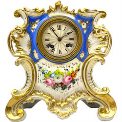 Early 19th century c1820 continental porcelain mantle clock in the Sevres Rocco style, decorated to the front with fired gilding and hand painted bouquet of flowers on a blue and white background, with a French two-train eight-day countwheel striking  movement and silk suspension, striking the hours and half-hours on a silvered bell, 2-1/2” silvered dial with roman numerals, minute track and steel moon hands within a beaded unglazed bezel. With pendulum.
 

