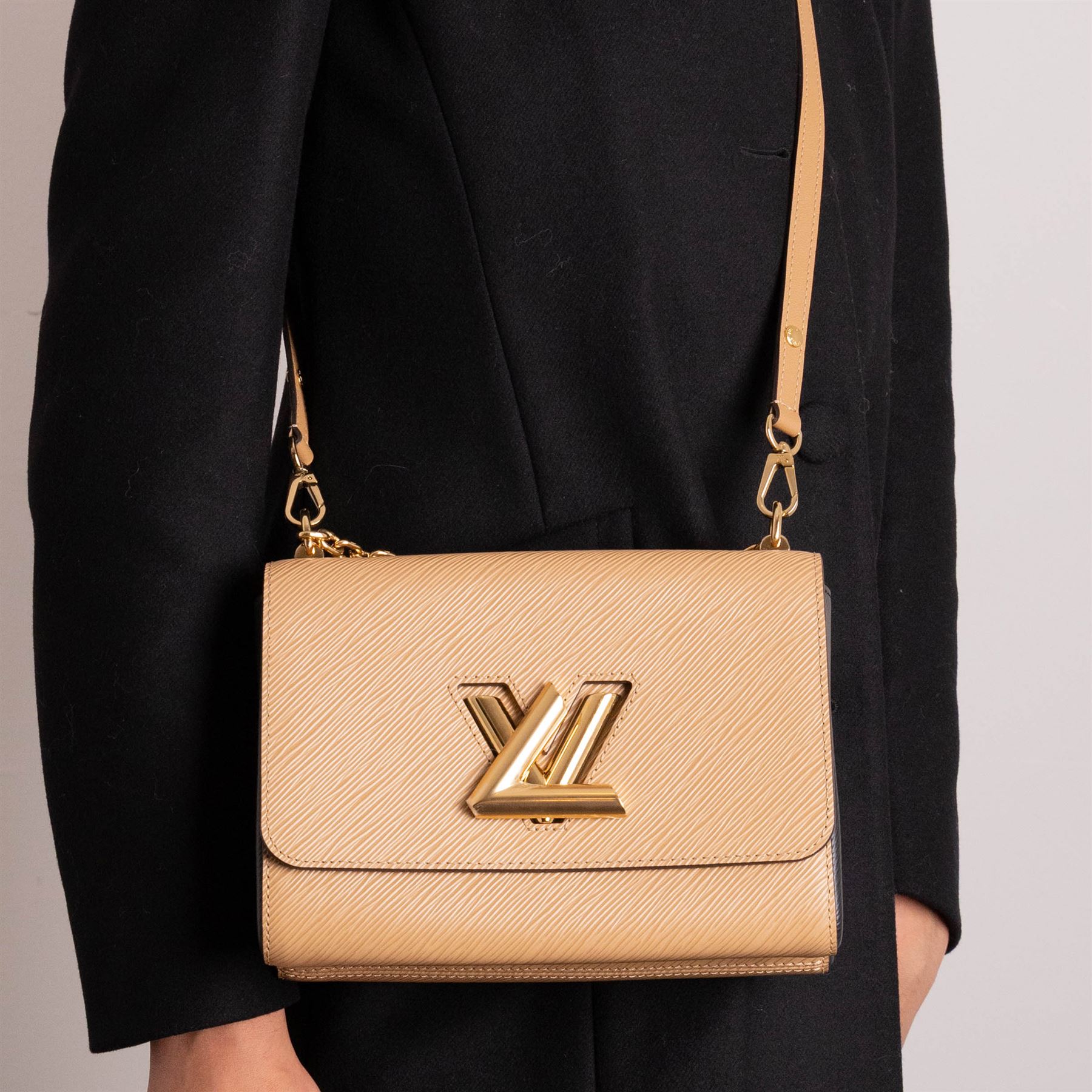 Louis Vuitton - ‘Twist’ MM Bag, the model introduced for the Cruise 2015 collection under Nicolas Ghesquière, in structured beige Epi cow hide leather with black sides, with gold-tone signature LV monogram twist-lock fastening and chain carrying handle, with detachable flat leather shoulder or crossbody strap, unused with original box and dust bag