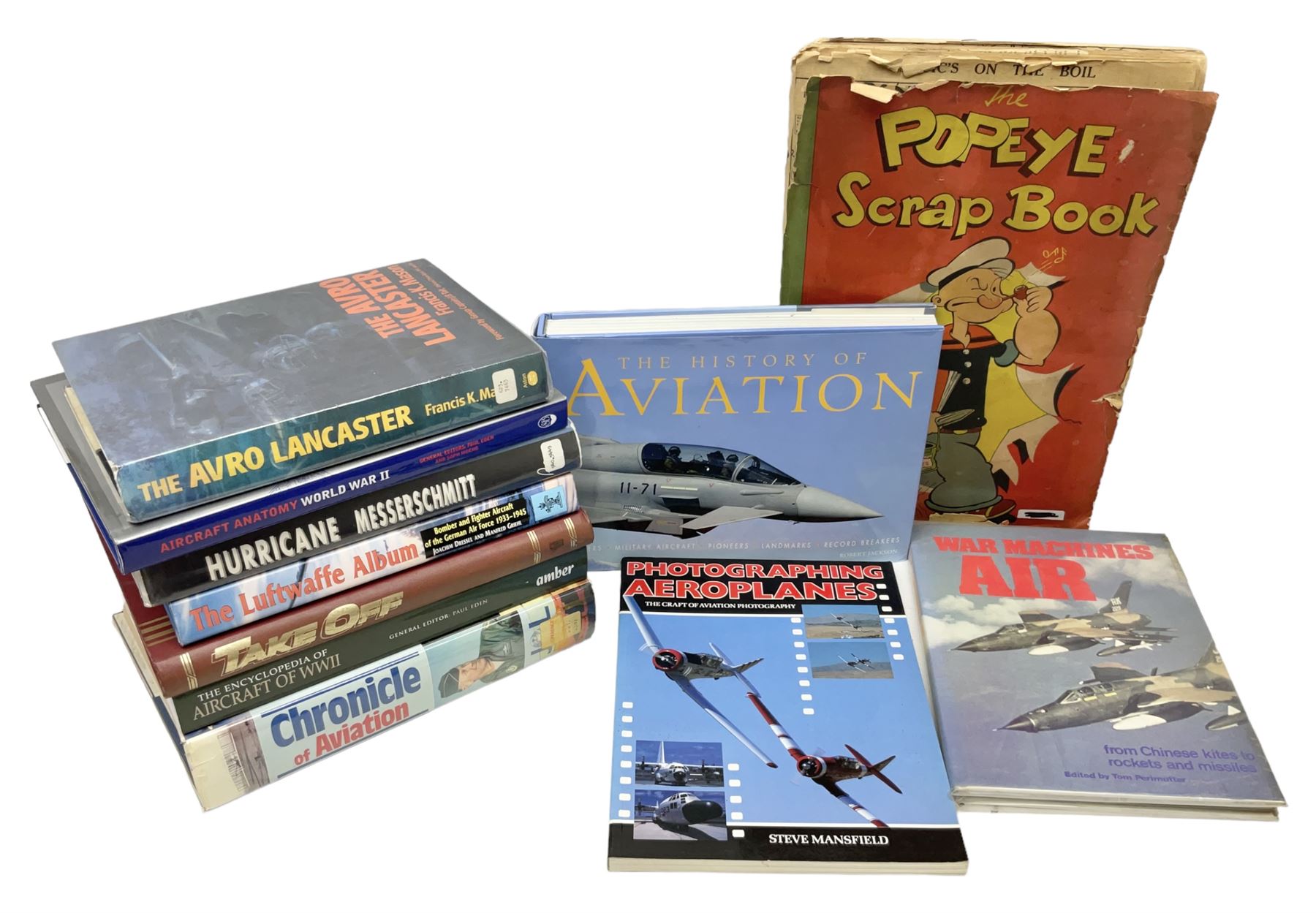 Ten books of predominantly military aircraft interest including Aircraft Anatomy World War Two, Hurricane Messerschmitt, The Avro Lancaster, The Luftwaffe Album, Encyclopaedia of Aircraft of WWII etc; together with a scrap album of WW2 newspaper cuttings