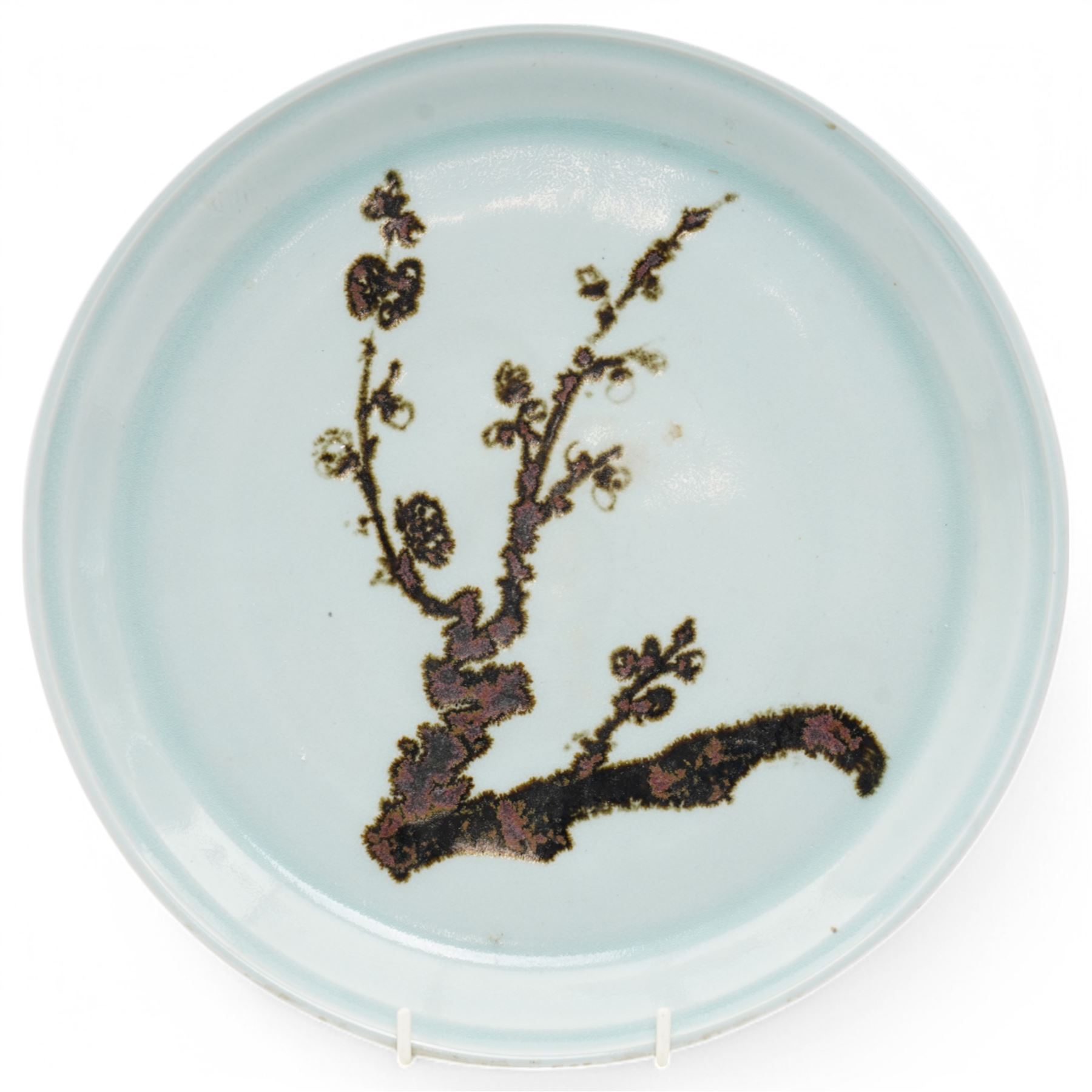 Poh Chap Yeap (Chinese/British 1927-2007); celadon glazed plate and solifleur vase, the plate decorated with a branch of cherry blossom, incised signature to bases, plate D29cm, vase H11cm (2)