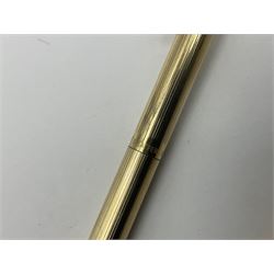 Sheaffer Triumph Imperial fountain pen, the gold plated barrel with fluted stripe design and gold nib stamped 14K 585, together with a Sheaffer Targa slimline fountain pen with gold plated barrel similarly decorated with gold nib stamped 14K 585, ballpoint pen and propelling pencil, each with a fluted gold plated barrel, largest L13.5cm (4)