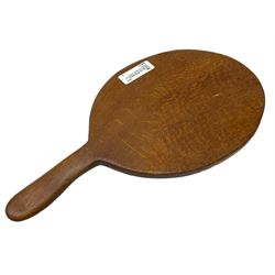 Mouseman - circa. 1940s/50s adzed oak cheese board, oval form with handle, the board carved with mouse signature, by Robert Thompson of Kilburn, L37cm D18cm 