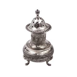 Indian silver pepperette, embossed with agricultural scenes, upon three pad feet, H8cm