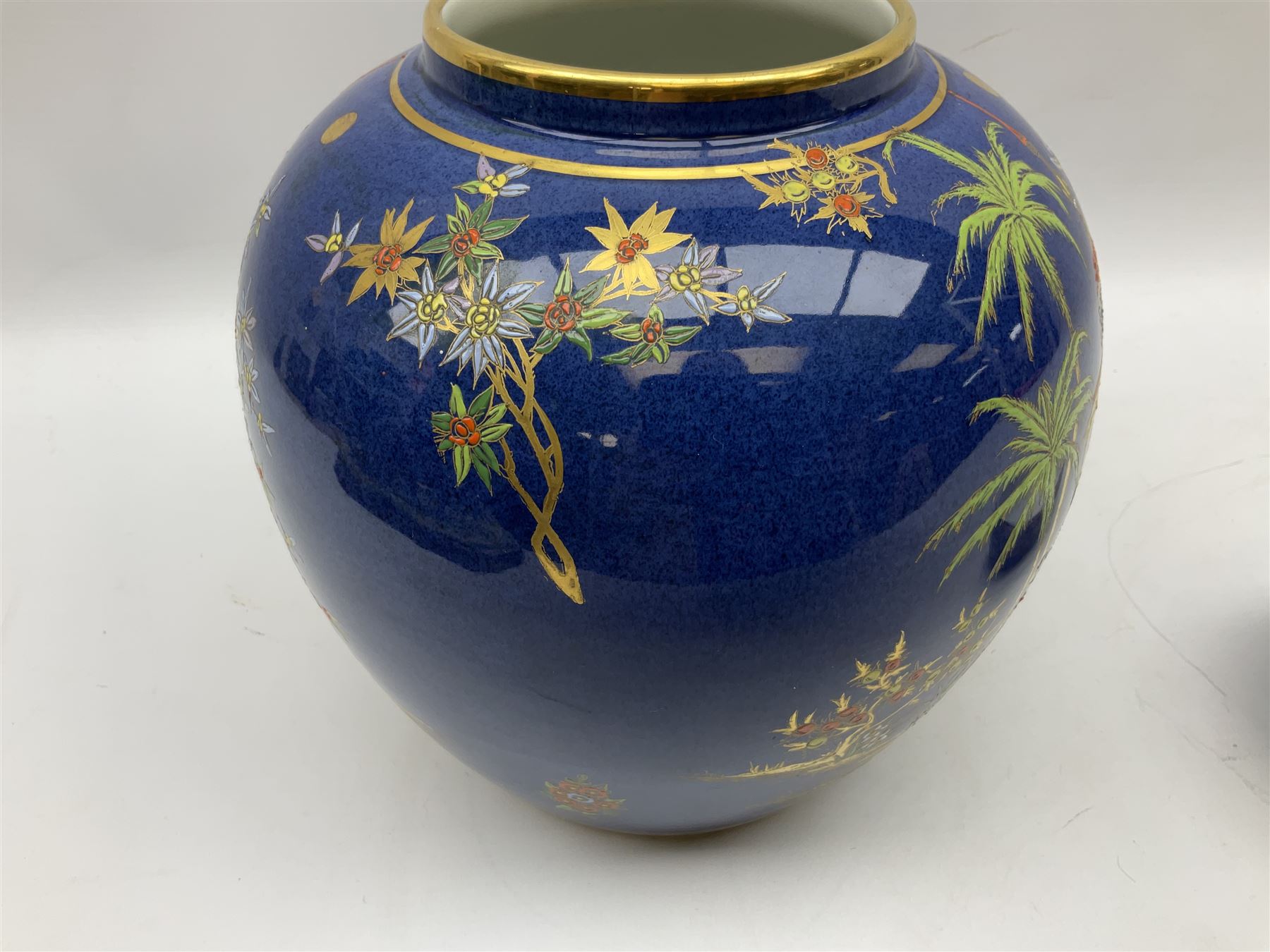 Carlton Ware Persian pattern ginger jar and cover decorated with an enamel and gilt Chinoiserie landscape with figures beside a pagoda upon a blue ground, with printed mark beneath, H27cm