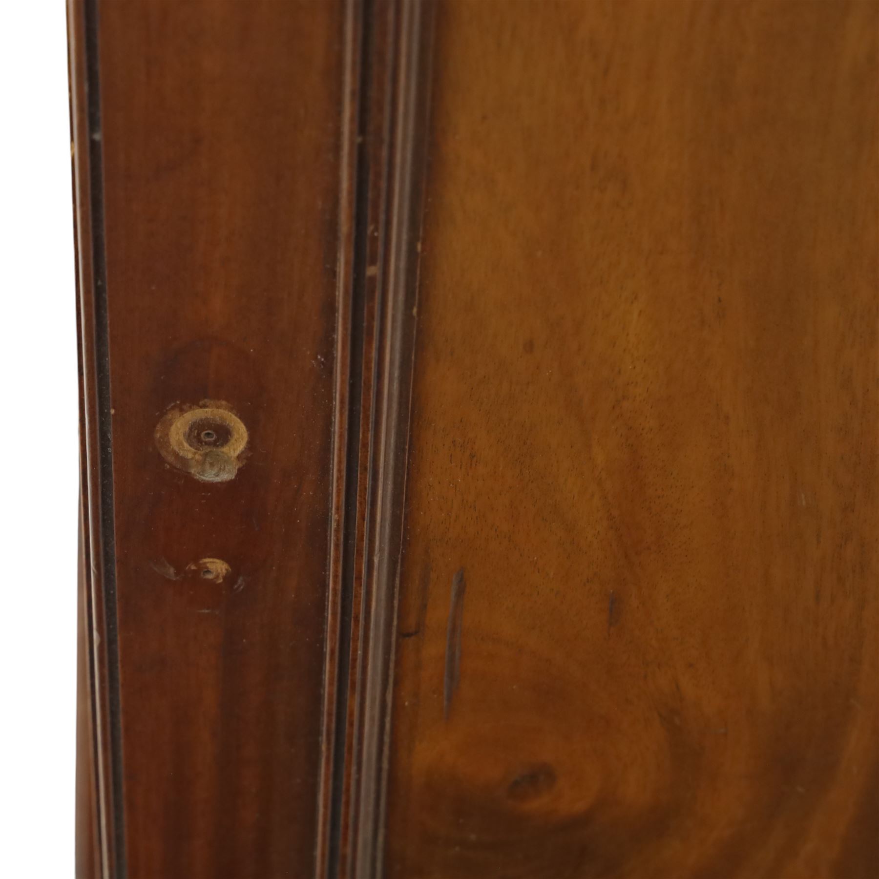 Two Edwardian mahogany bedside cabinets, each enclosed by a single panelled door, one with a raised gallery back and square tapering legs (H 84cm, W 40cm, D 40cm), the other of plinth-base form (H 77cm, W 40cm, D 35cm)