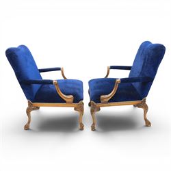 Pair of George II design Gainsborough armchairs in deep blue upholstery, shaped back over scrolled and carved arms, with cabriole supports and carved shell knees terminating in claw on ball feet