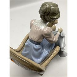 Lladro figure, Mommy It's Cold, modelled as a young girl being draped with a towel by her mother, sculpted by Joan Coderch, with original box, no 5715, year issued 1990, year retired 1993, H20cm