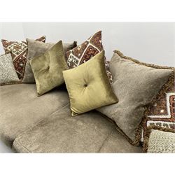 Alexander James - Grand two sectional sofa upholstered in studded leather and fabric, with contrasting kilim patterned scatter cushions, scrolling arms and turned front supports 