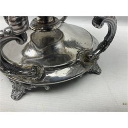 Victorian silver plated tea kettle of baluster form on stand, the bulbous body with floral and foliate decoration and two vacant reserves, foliate scroll handle and domed cover, raised upon the foliate stand and burner, H41cm