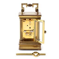 Matthew Norman - Modern repeating carriage clock with Swiss movement, white dial, brass and bevelled glass case H14cm, boxed and a miniature carriage clock by the same maker H9cm, boxed (2) 