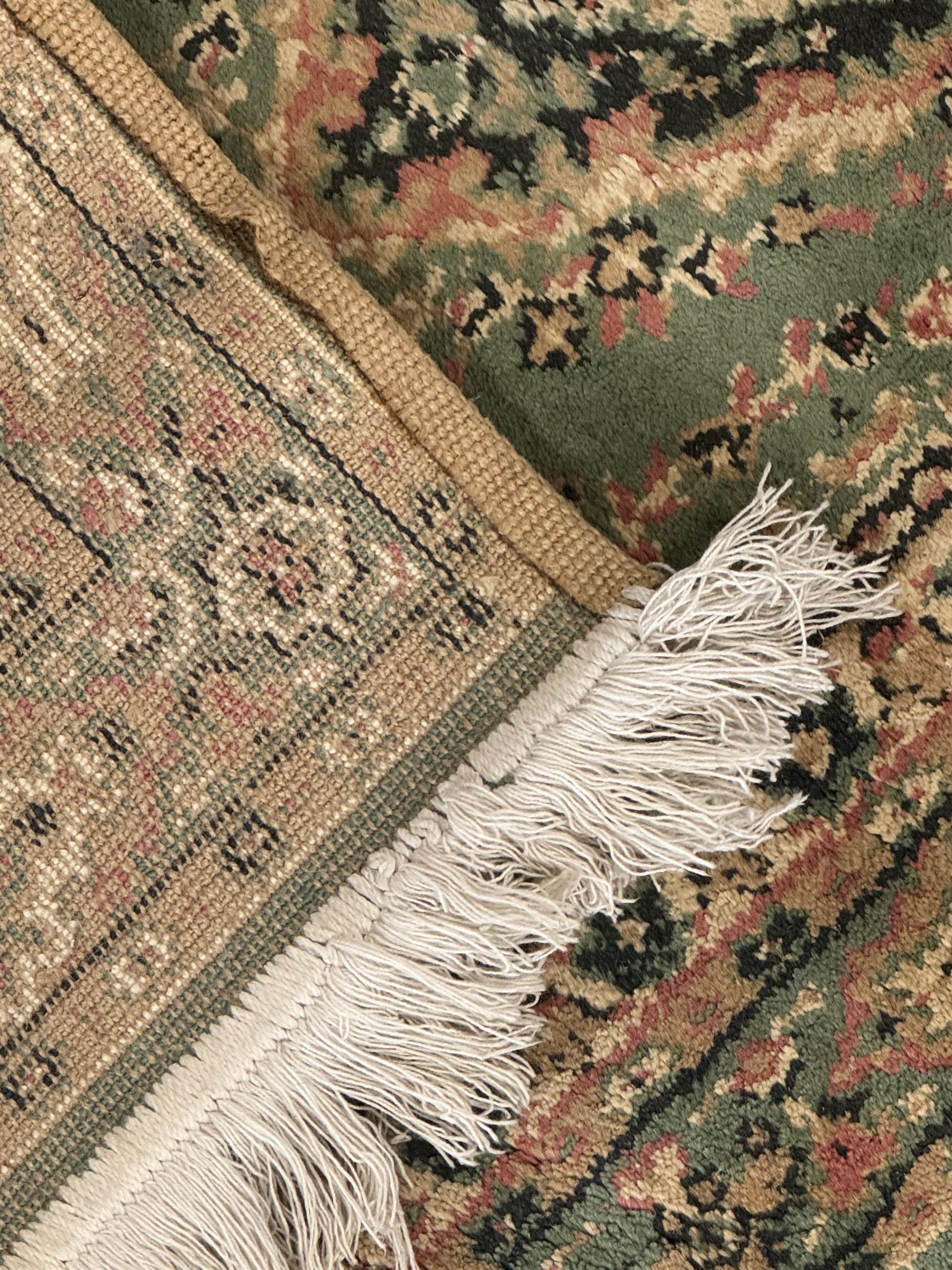 Pair of Bangladeshi olive ground runner rugs, machine-made with 100% jute pile, each with three central diamond-shaped medallions with intricate floral motifs, the field decorated with scrolling floral designs, bordered by stylised floral patterns 