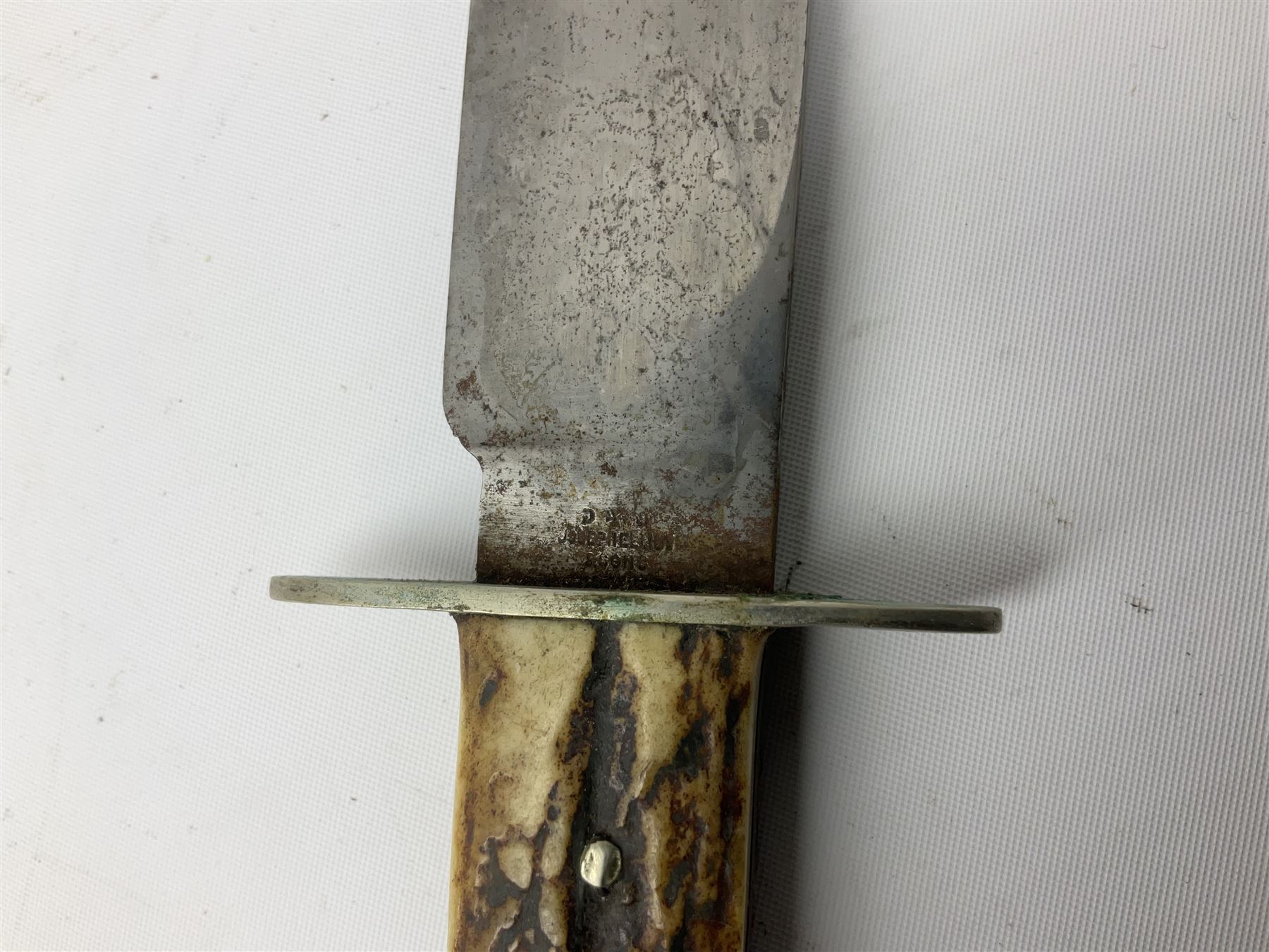 Hunting knife by J Nowill & Sons, Sheffield, the handle inset with mother of pearl, blade length 19cm; George Wolstenholme IXL lock-knife with antler scales L29cm open; and another Bowie style hunting knife marked 'V.R. Warranted Sheffield Joseph Ellis & Sons' in leather sheath (3)