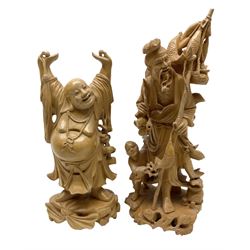 Two Japanese carved wood okimonos, to include example modelled as a fisherman holding his catch in one hand and pipe in the other, and his child, tallest H25cm