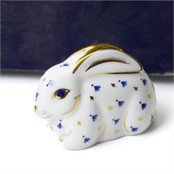 Six Royal Crown Derby paperweights comprising 'Hawthorne' hedgehog with gold stopper, baby rabbit with gold stopper, 'Molly' dog guild exclusive with gold stopper, farmyard hen with gold stopper, woodland squirrel with gold stopper, and collectors guild puppy with gold stopper, all boxed (6)