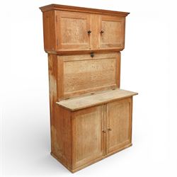 Early 20th century 'Quicksey' oak kitchen larder, rectangular moulded cornice over a pair of panelled cupboard doors, the fall front enclosing a white enamel work surface with fitted interior comprising original glass drawers, storage compartments and shelf, the lower section with twin panelled cupboard doors enclosing shelving and divided storage, raised on a plinth base