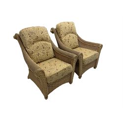 Four piece cane conservatory suite - two seat sofa (W130cm), pair of armchairs (W85cm), and coffee table (85cm x 60cm)