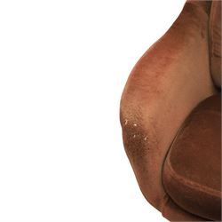 Pair of mid 20th century brown velvet swivel lounge chairs and matching footstool, the shaped and padded back with buttoned segmented cushion over conforming seat cushion, flared armrests and moulded sides, raised on a five point metal swivel base, the footstool en suite with buttoned cushion and matching metal base