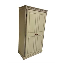 Painted double wardrobe, spiral turned design on cornice and uprights, two panelled doors enclosing shelf and hanging rail, in latte finish
