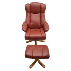 Mid-20th century design reclining armchair with swivel action, upholstered in red leather, raised on U-shaped supports with quadruform base, with matching footstool
