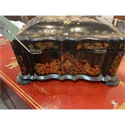Victorian black lacquered papier-mâché sewing box, of rectangular form with shaped sides, the slightly domed top with inlaid mother of pearl and abalone decoration, the sides with gilt and polychrome painted scrollwork, the hinged cover opening to reveal a fitted interior with lift out tray, H14cm